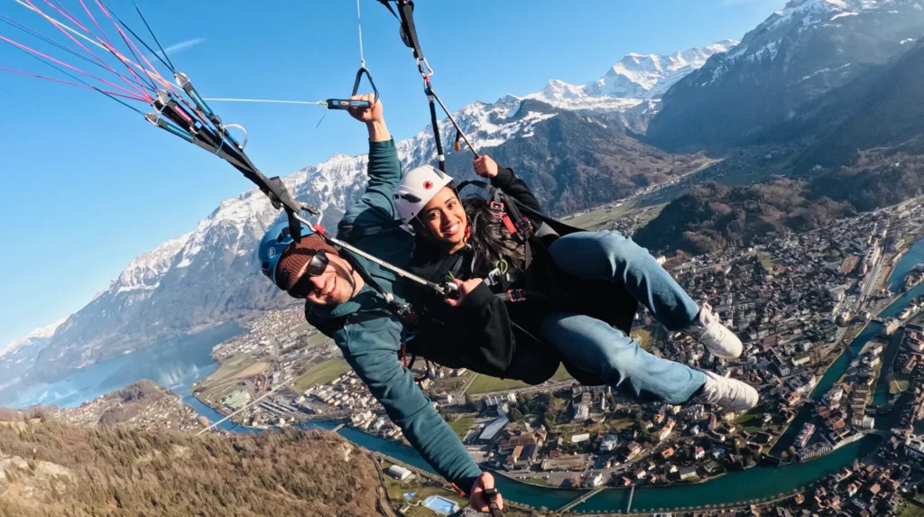 Swiss Paragliding in Interlaken on front of a great Panorama of the Alps